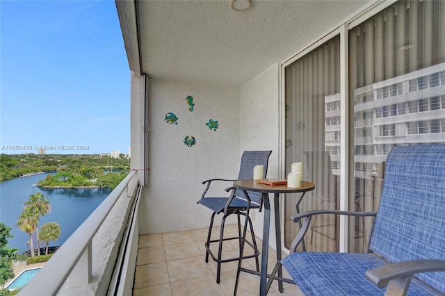 balcony featuring a water view