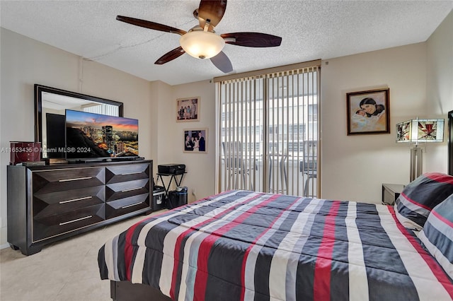 tiled bedroom with a textured ceiling and ceiling fan