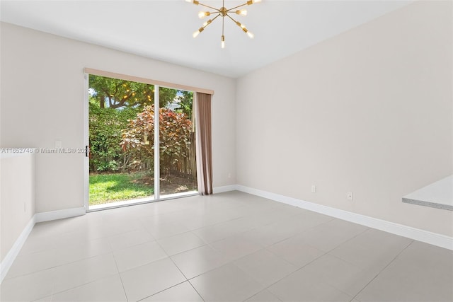 empty room featuring plenty of natural light, a chandelier, and light tile patterned flooring