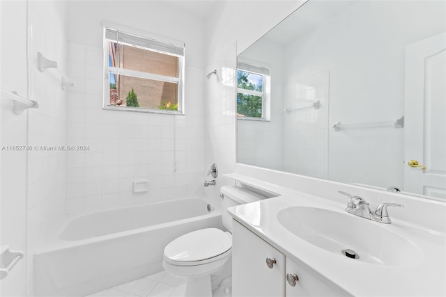 full bathroom with tile patterned flooring, vanity, toilet, and tiled shower / bath