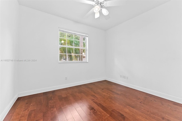 empty room featuring ceiling fan and dark hardwood / wood-style floors