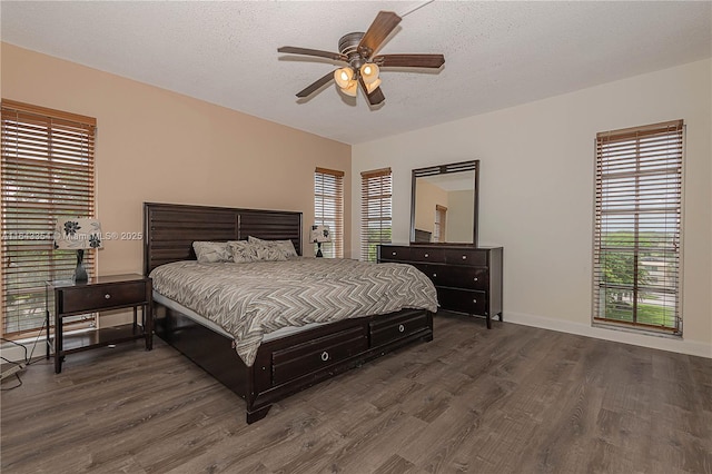 3200 N Palm Aire Dr Unit 501, Pompano Beach, FL 33069 - bedroom featuring dark wood finished floors, baseboards, a ceiling fan, and a textured ceiling