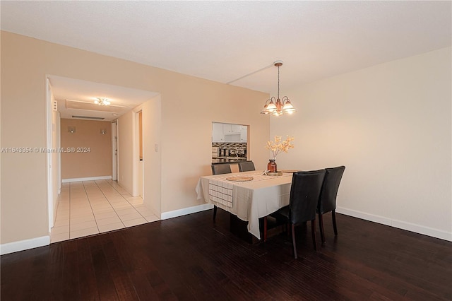 dining area featuring a chandelier and light hardwood / wood-style floors