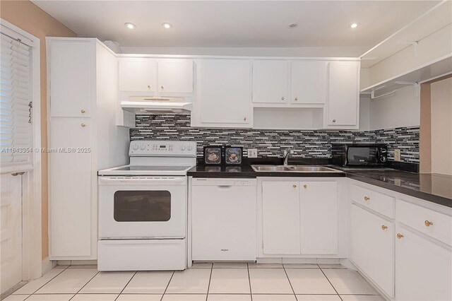 kitchen featuring white cabinetry, sink, light tile patterned floors, and white electric range oven