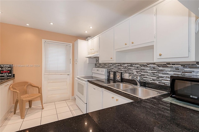 kitchen featuring sink, light tile patterned flooring, backsplash, white appliances, and white cabinets