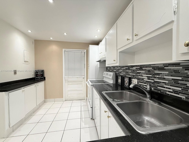 kitchen featuring light tile patterned flooring, under cabinet range hood, a sink, electric stove, and backsplash