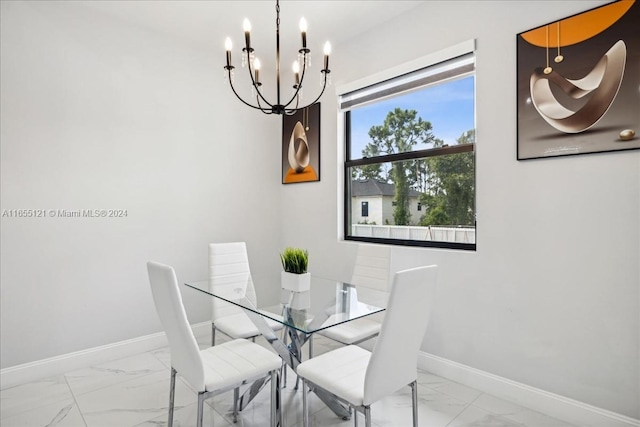 dining room with a notable chandelier