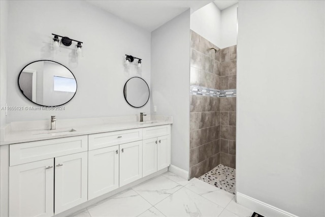 bathroom featuring vanity and a tile shower