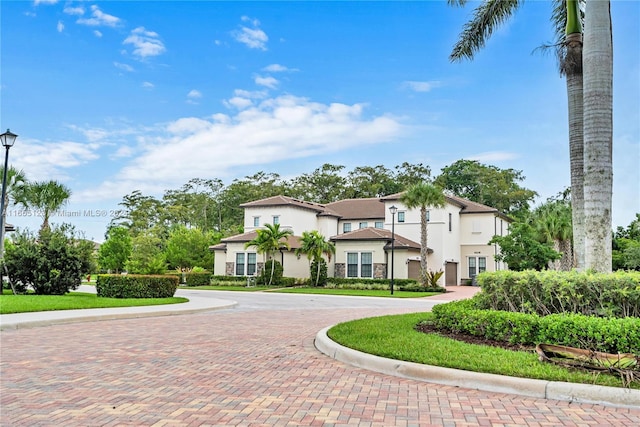 9206 Passiflora Way Unit 101, Boca Raton, FL 33428 - view of front of home with stucco siding and curved driveway
