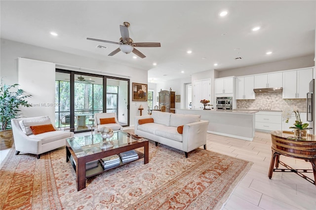 living room featuring ceiling fan