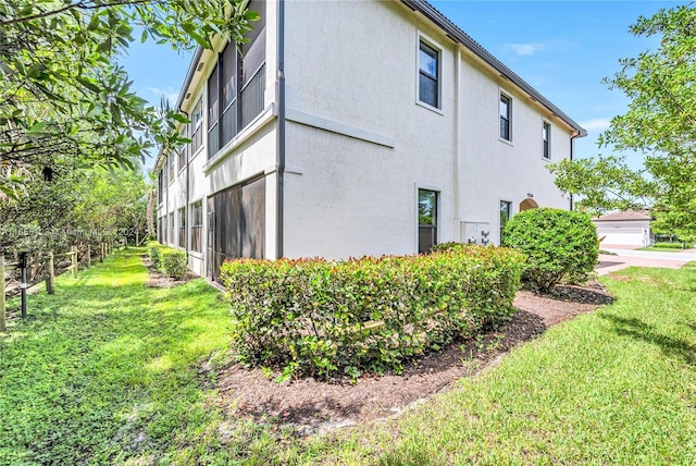 9206 Passiflora Way Unit 101, Boca Raton, FL 33428 - view of property exterior featuring stucco siding and a lawn