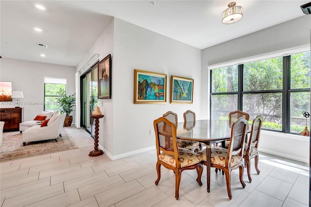 dining space featuring light hardwood / wood-style floors and plenty of natural light