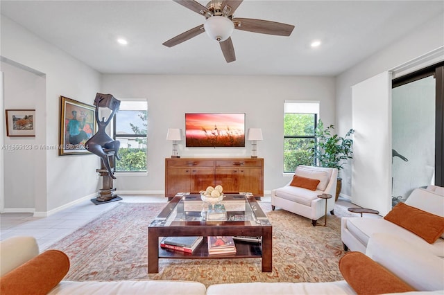 living room featuring light tile patterned flooring and ceiling fan