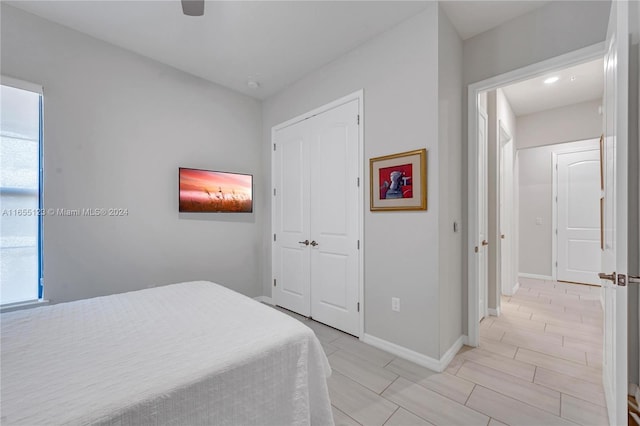 bedroom featuring ceiling fan and multiple windows