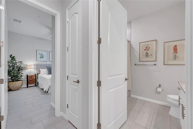 9206 Passiflora Way Unit 101, Boca Raton, FL 33428 - ensuite bathroom featuring tile patterned floors and vanity