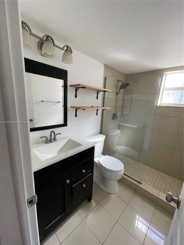 kitchen featuring sink, stacked washing maching and dryer, tasteful backsplash, dark stone counters, and white appliances