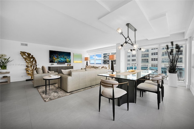 dining space featuring a notable chandelier