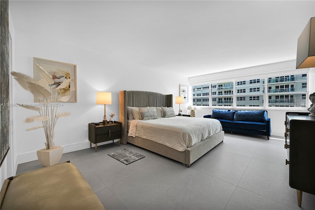 bedroom with light tile patterned floors