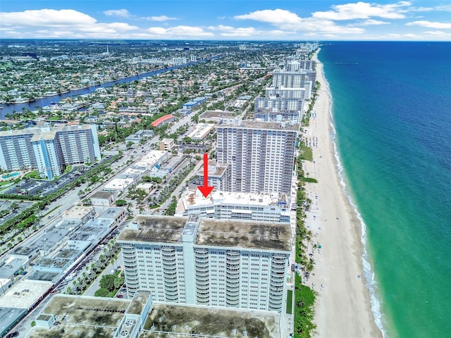 drone / aerial view with a view of the beach and a water view