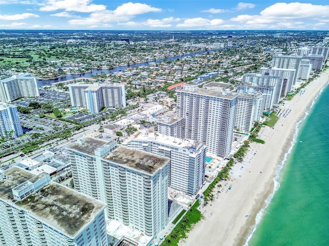 birds eye view of property featuring a view of the beach and a water view