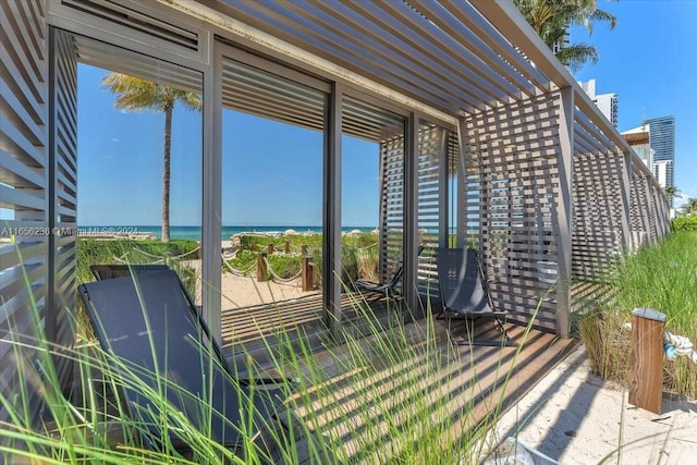 exterior space with a pergola and a water view