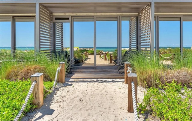 view of exterior entry with a water view