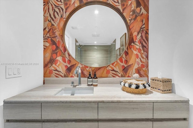 bathroom featuring vanity and a shower