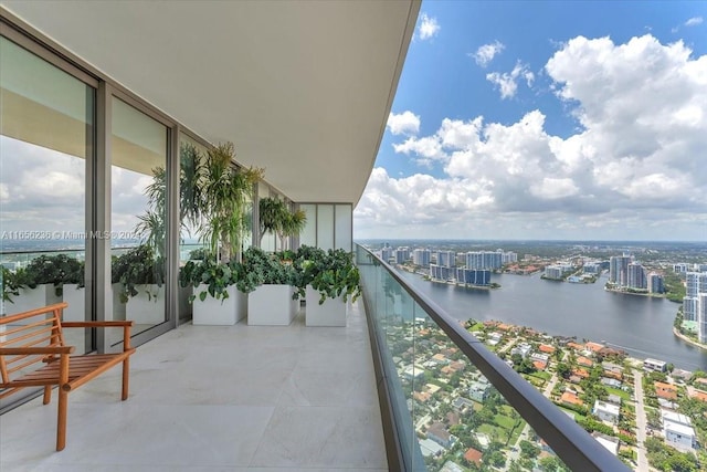 balcony with a view of city and a water view