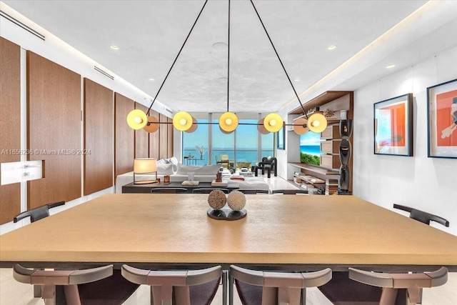 kitchen with visible vents and a kitchen breakfast bar