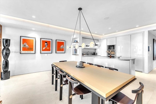 dining space featuring recessed lighting