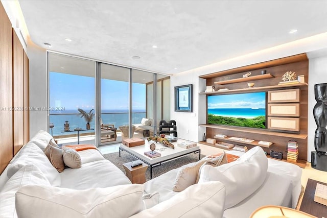 living area featuring recessed lighting and floor to ceiling windows