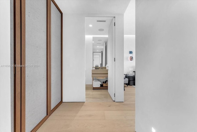 hallway with light wood-type flooring