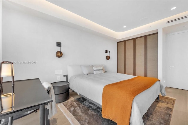 bedroom featuring hardwood / wood-style floors