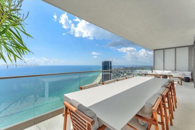 balcony featuring a water view and an outdoor hangout area