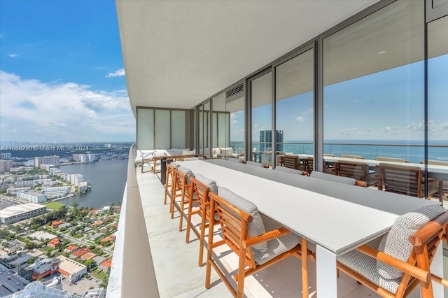 balcony featuring a water view