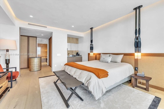 bedroom featuring light wood-type flooring