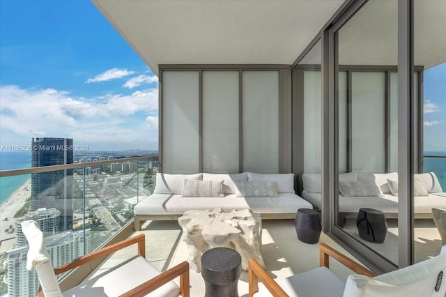 balcony with a water view and outdoor lounge area