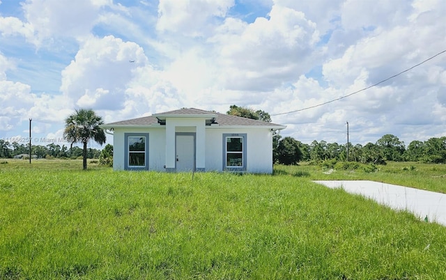 exterior space featuring a front lawn