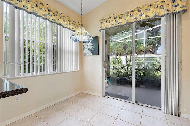 doorway to outside featuring a healthy amount of sunlight and tile patterned floors