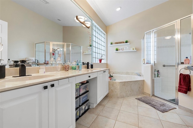 bathroom featuring vanity, plus walk in shower, and tile patterned floors