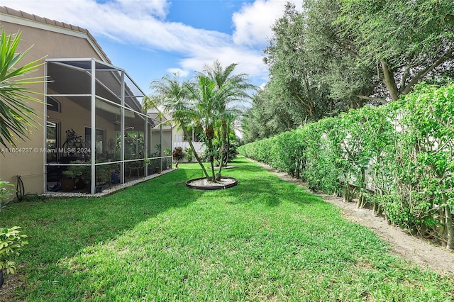 view of yard with a lanai