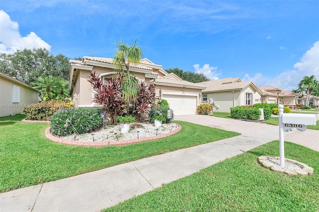 view of front of house with a front yard and a garage