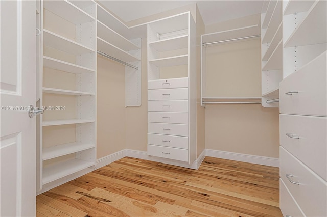 walk in closet featuring hardwood / wood-style flooring