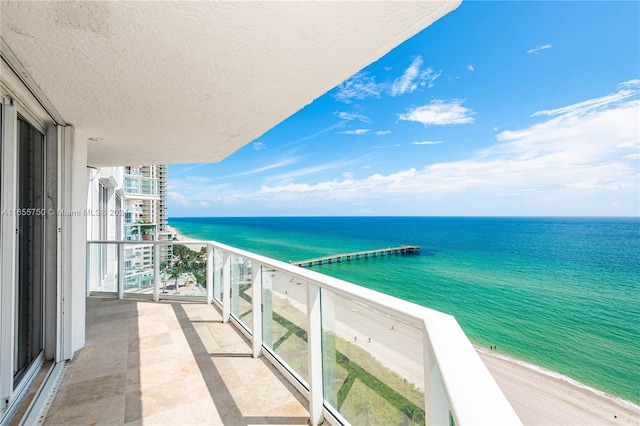 balcony featuring a water view