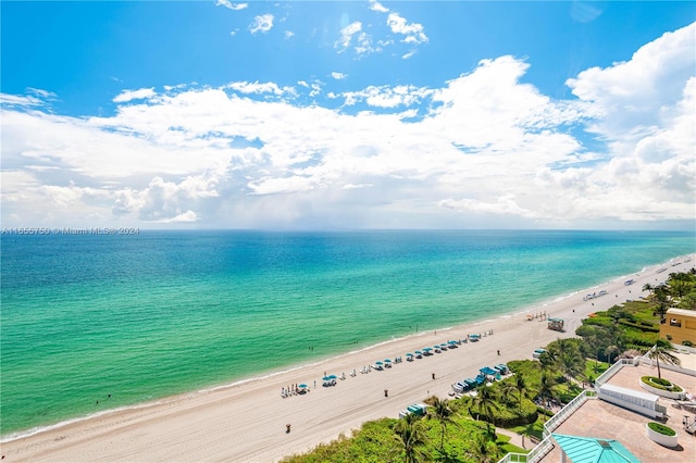 exterior space featuring a beach view and a water view