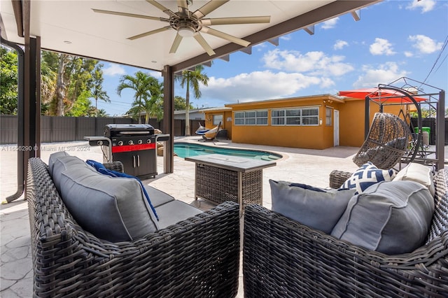 view of patio / terrace with outdoor lounge area, a fenced in pool, a grill, and ceiling fan