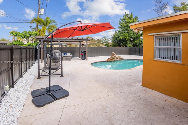 view of pool featuring a patio and a gazebo