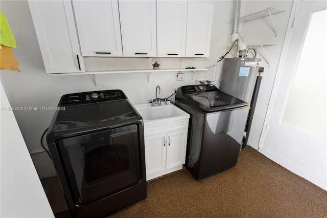 laundry area with independent washer and dryer, cabinets, and sink