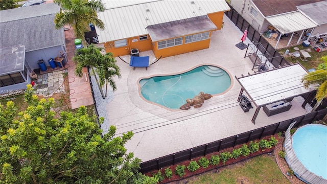 view of swimming pool with a patio area