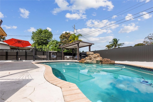 view of swimming pool with a patio